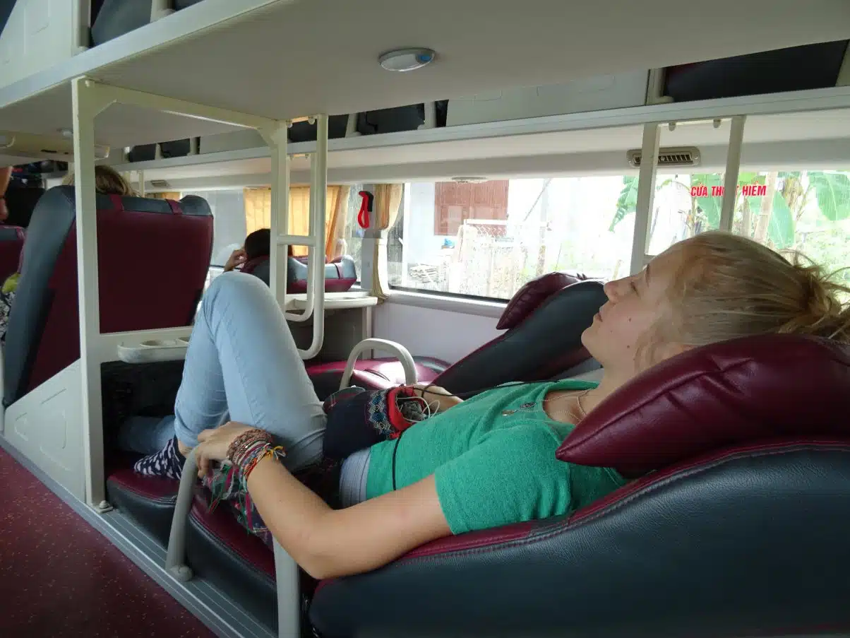 Girl sleeping on sleeper bus Asia