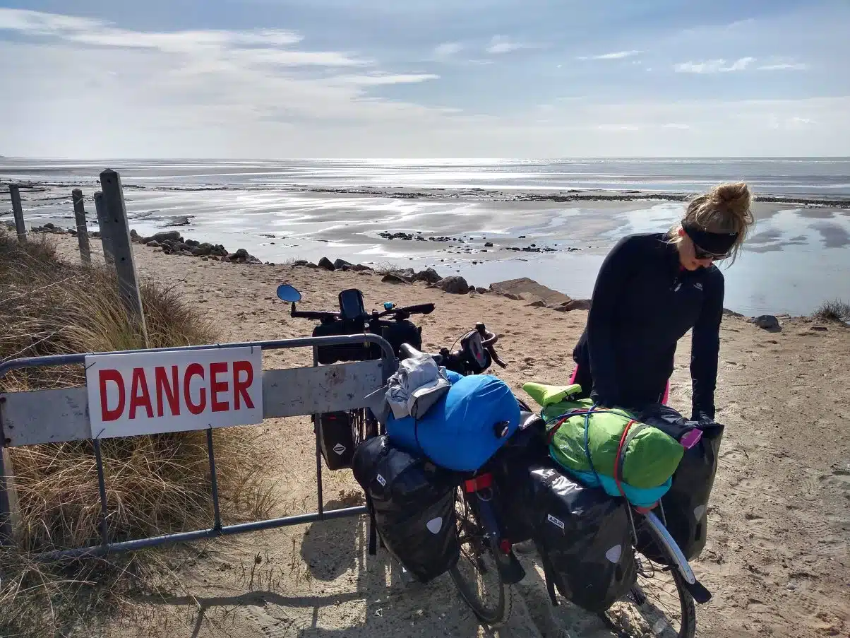 Girl Bike Tour Camping on the beach