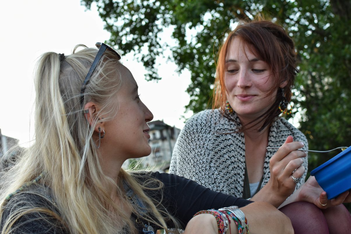 Two beautiful women chatting and laughing 