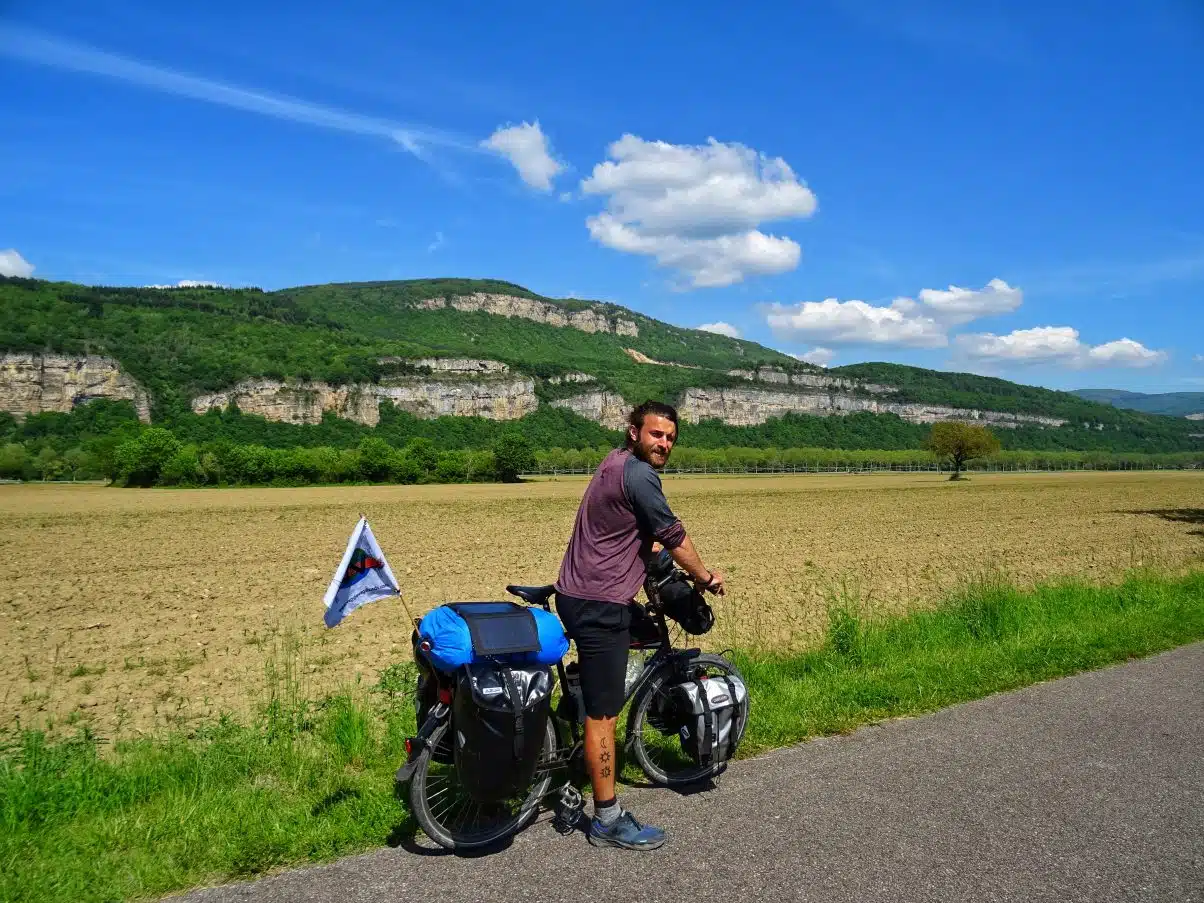 Man on bike on Via Rhona in countryside 