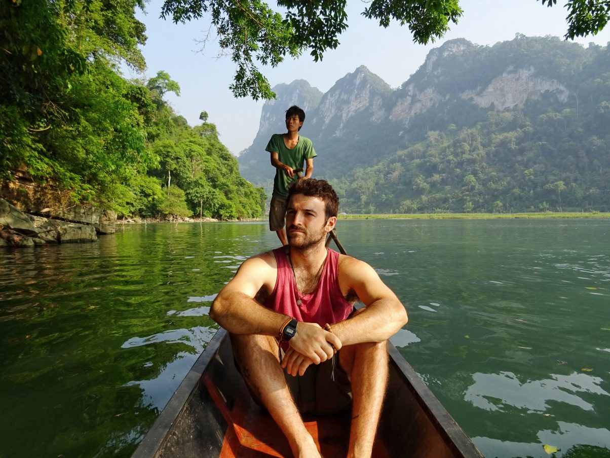 Man on Vietnamese boat Ba Be Lake