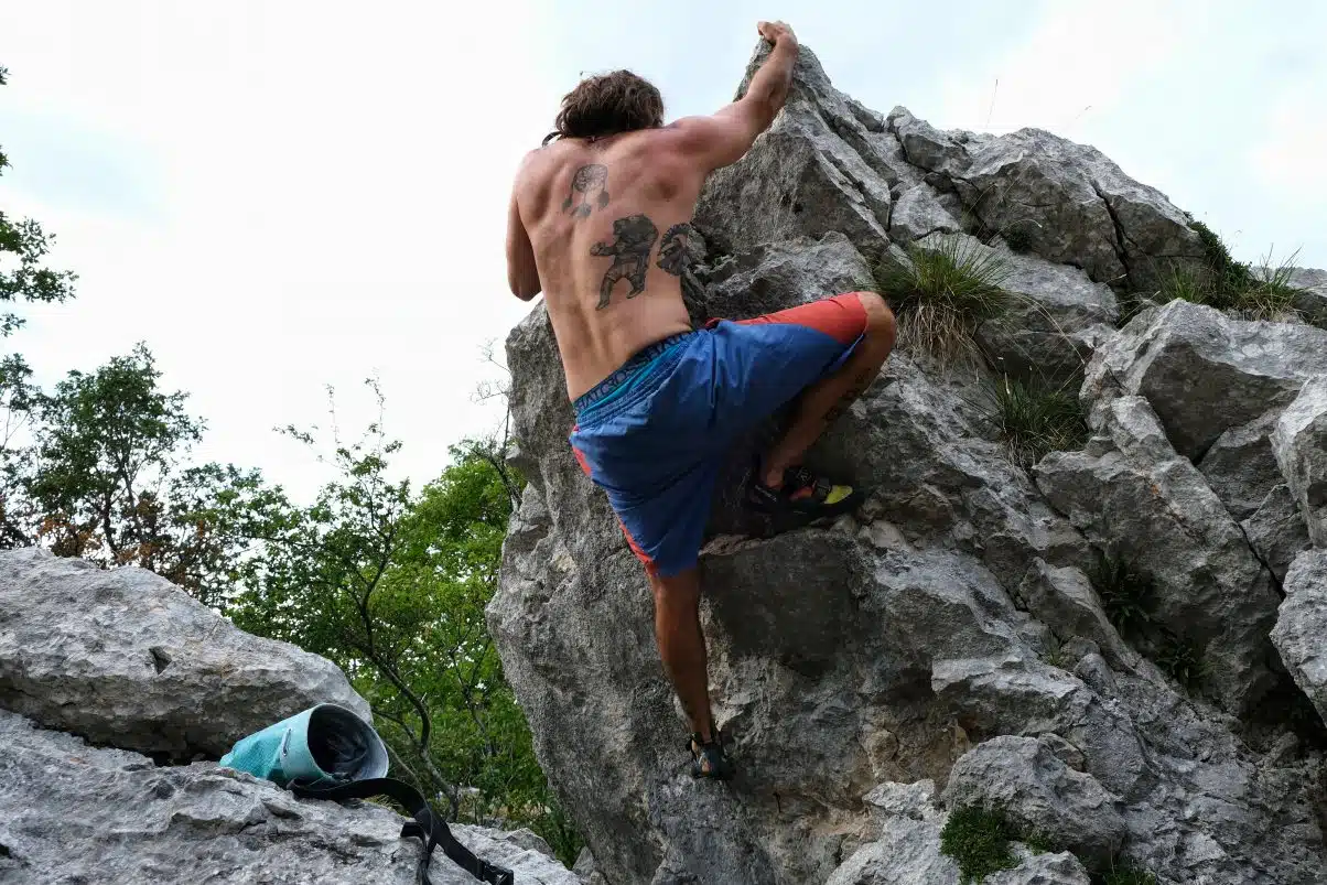 Man climbing boulder