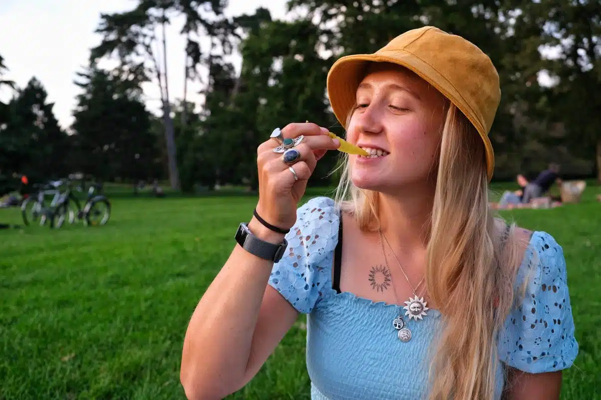 Girl eating in park 