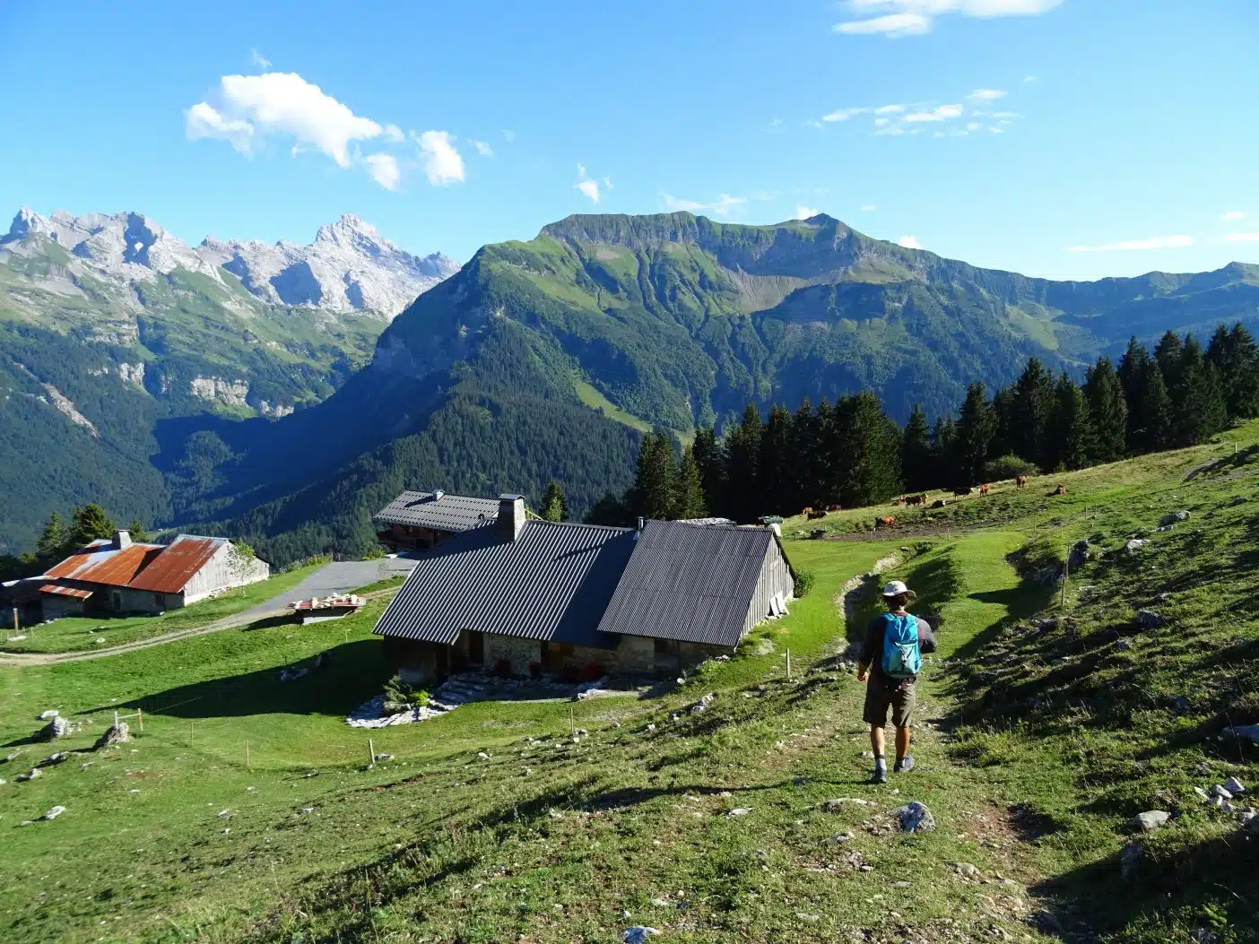 Man walking through mountains in France on an eco hiking trip