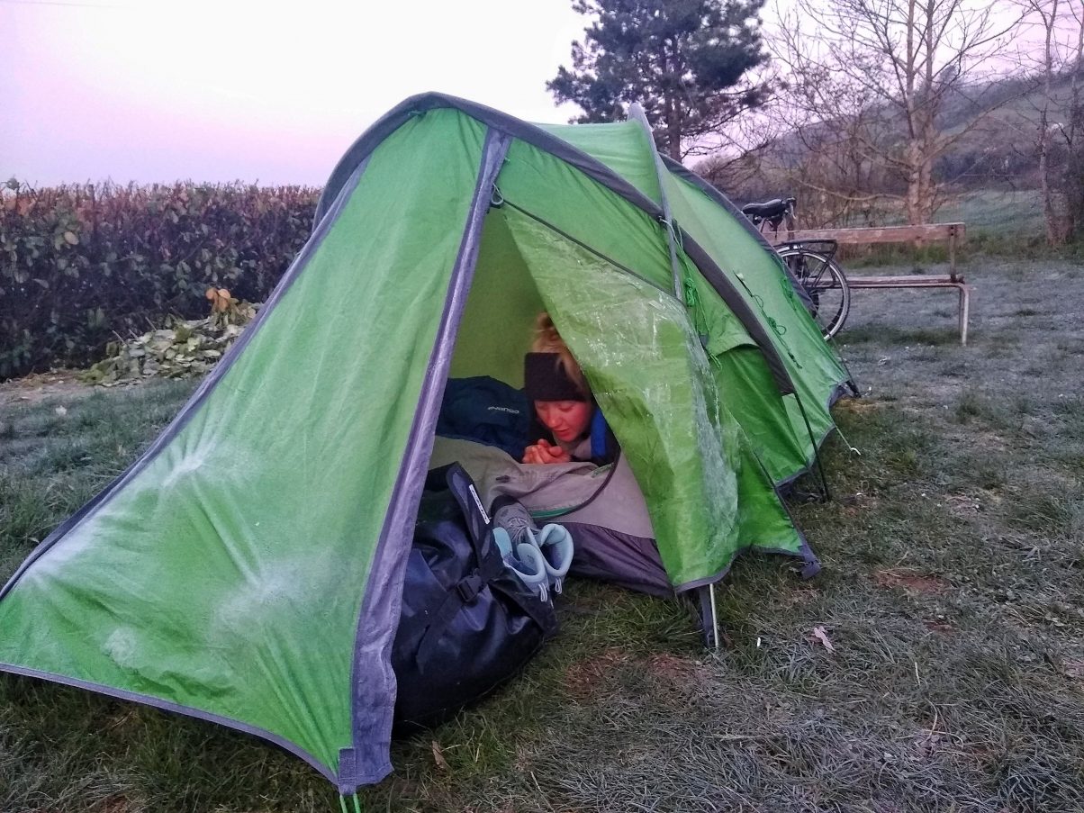 girl camping in frozen tent