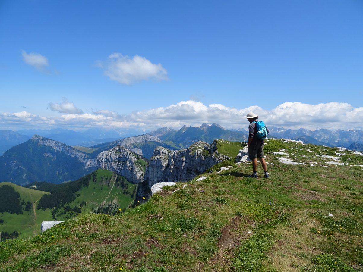 Man overlooking mountain ridge in the French Alps