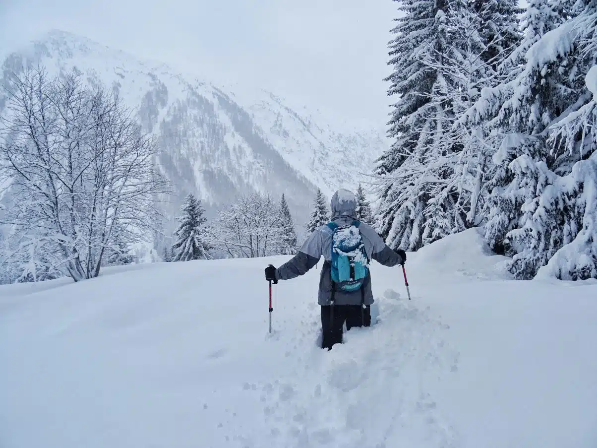 Man hiking in snow with waterproof vegan boots