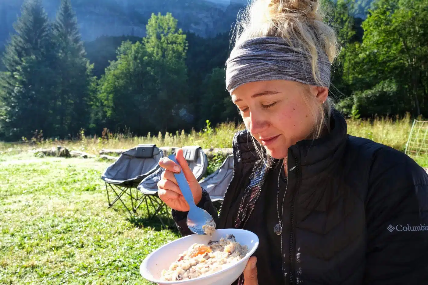 Girl eating vegan camping breakfast 