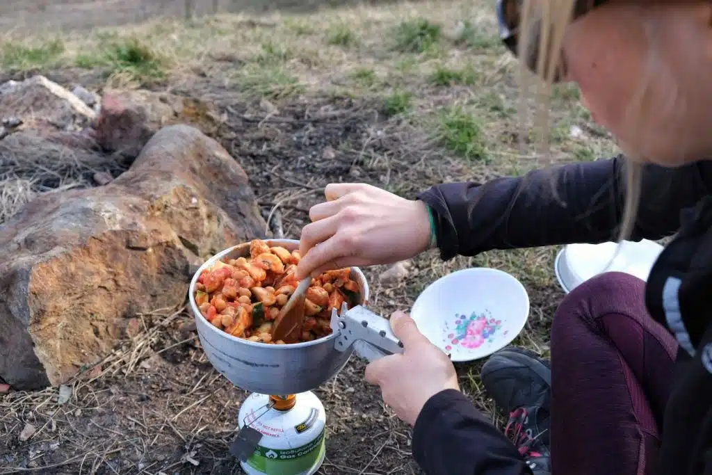 Girl making vegan camping food