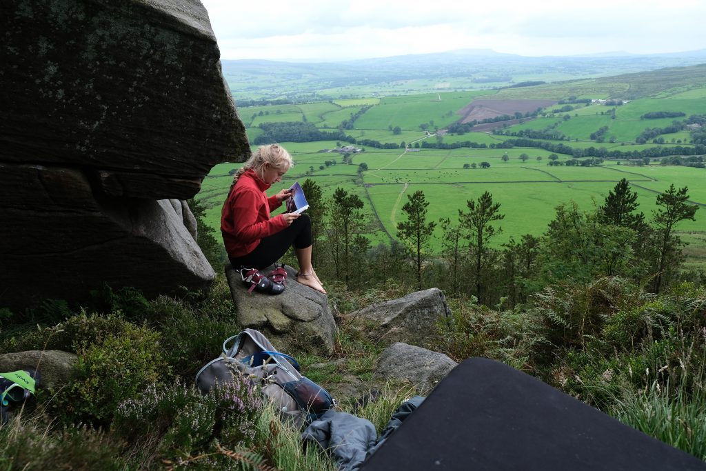 Climbing girl searching for outdoor activity ideas