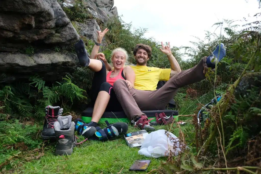The Reality of Being a Vegan Outdoor Lover 7 Couple sitting of climbing crash pad in countryside