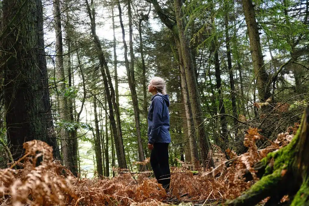 Girl hiking through the woods