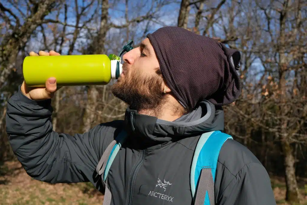 Man wearing vegan coat in woods