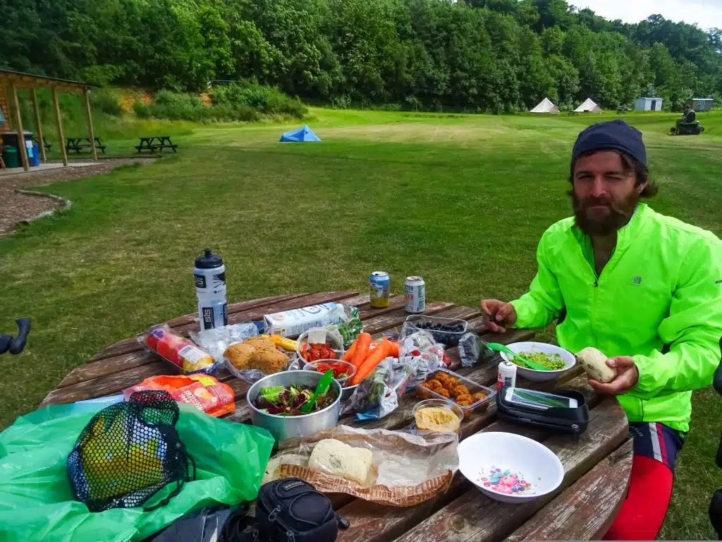 Cycle tourer having picnic in park