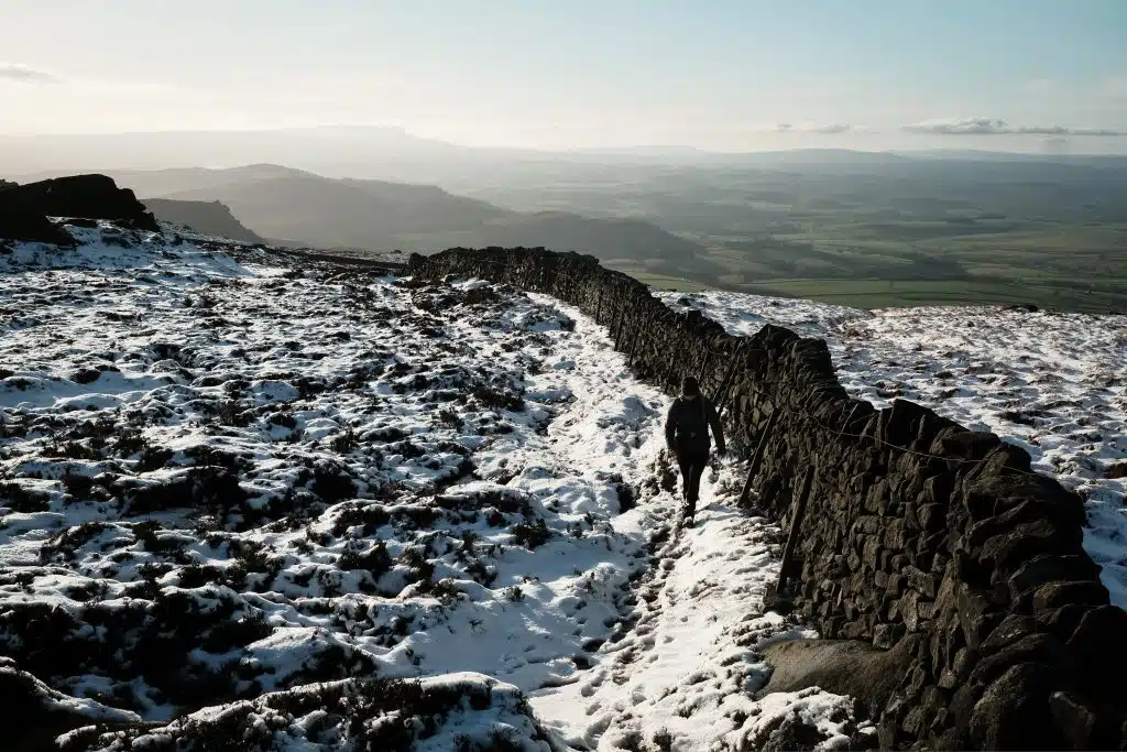 Woman hiking in snow