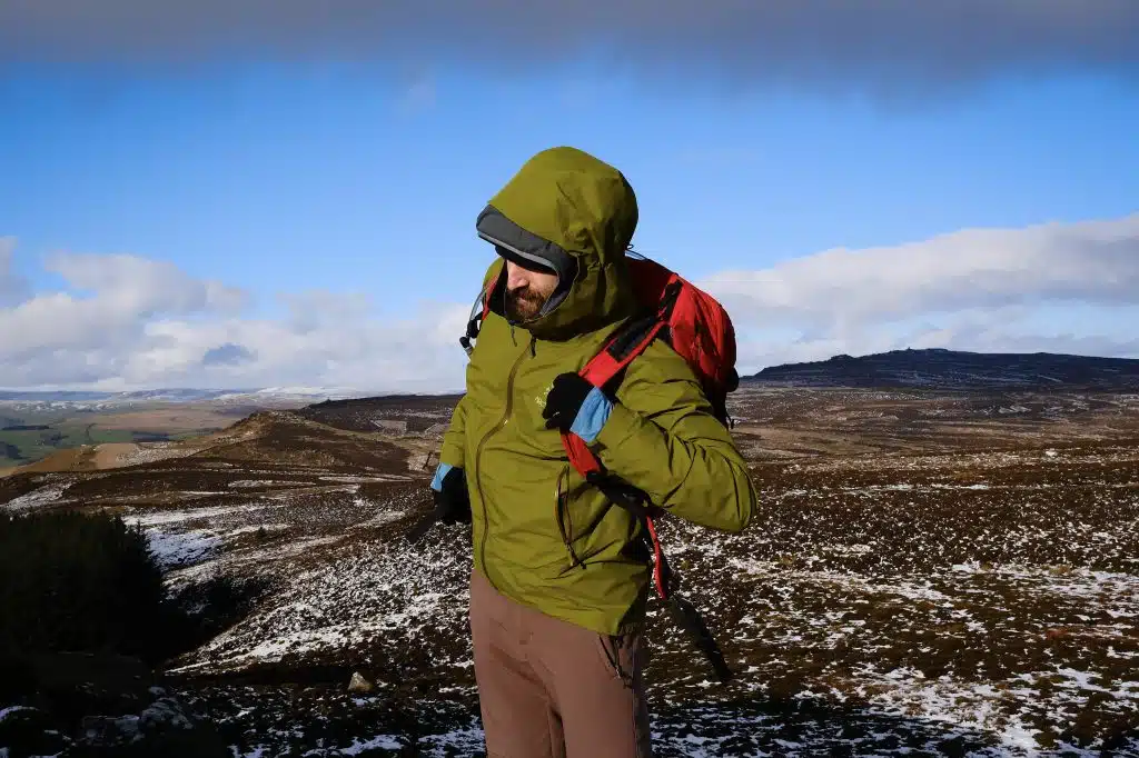 Man wearing waterproof rain jacket