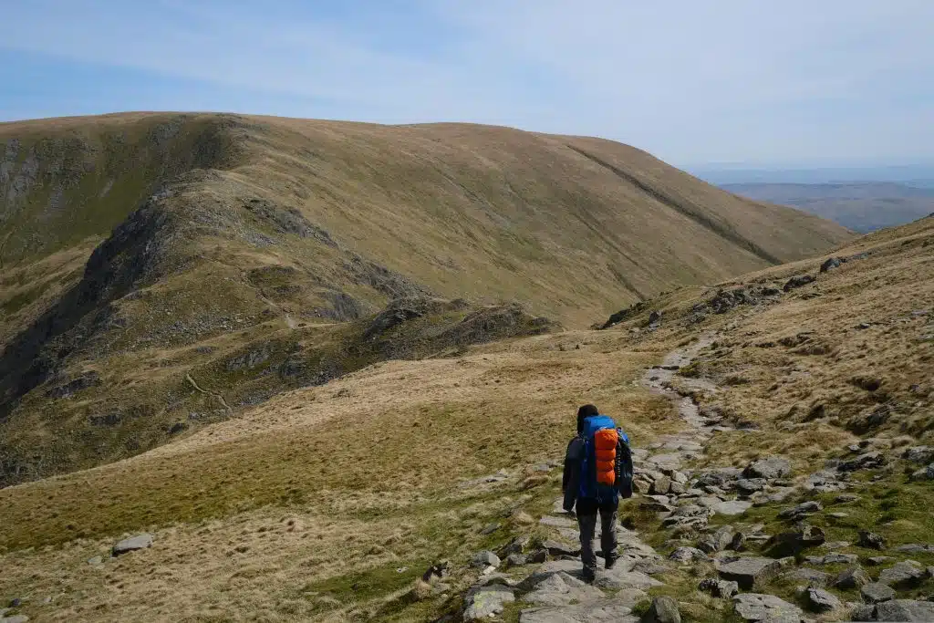 Man backpacking in the mountains