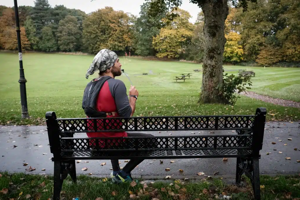 Runner drinking from a water bladder